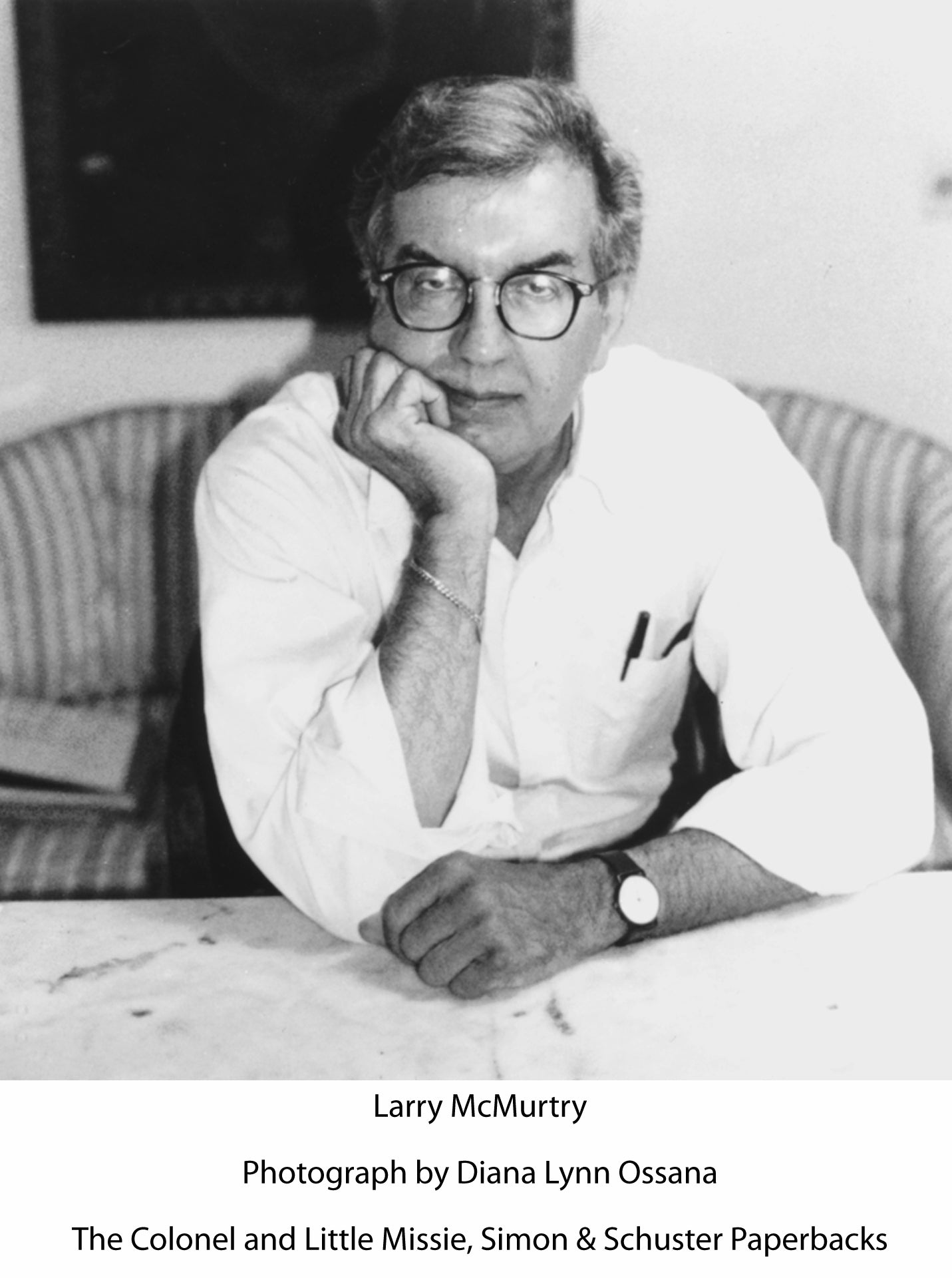 Larry McMurtry wearing glasses and a white shirt.